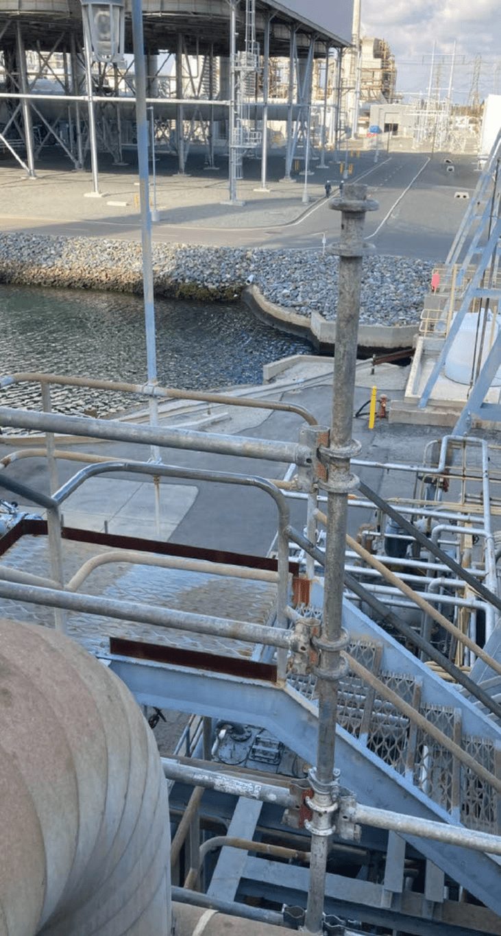 Scaffolding and process piping at an industrial refinery site where Enviro-Chem provides environmental consulting and project oversight.